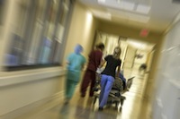 medical staff rushing a patient into the emergency room